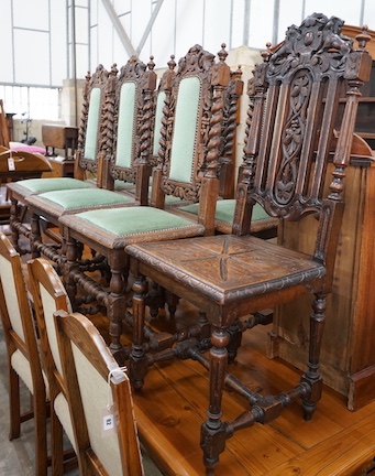 A set of six 19th century Carolean style carved oak dining chairs and one other similar chair (7)